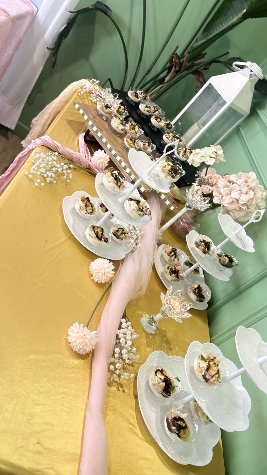 Floral baby shower grazing table with individual food cups at Aura Indian Cuisine